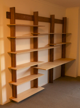 Custom made cantilevered bookshelves, Australian blackwood frame, plywood shelves, finished with Danish oil and bees wax
